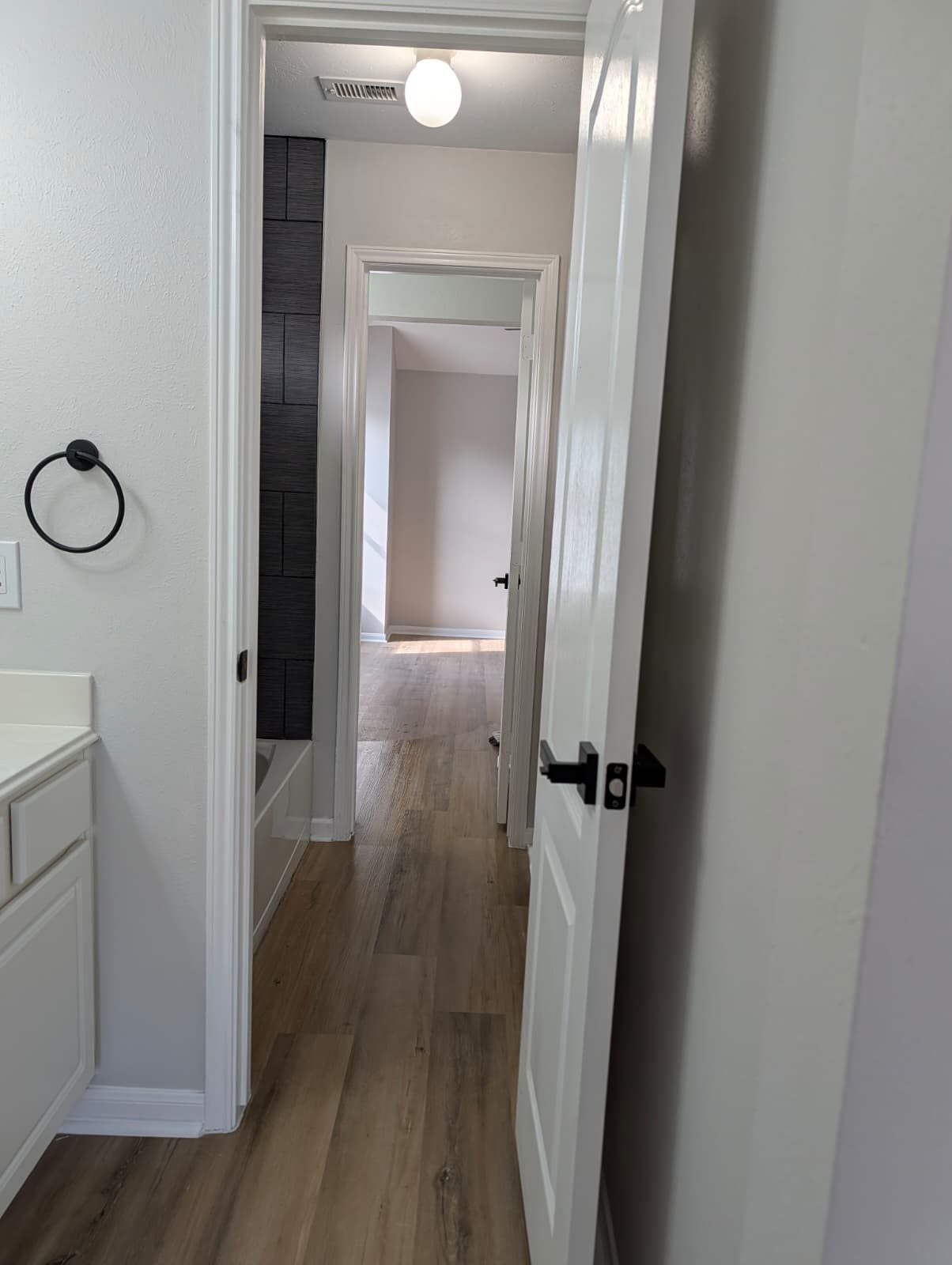 Looking from the bathroom down the finished hallway
