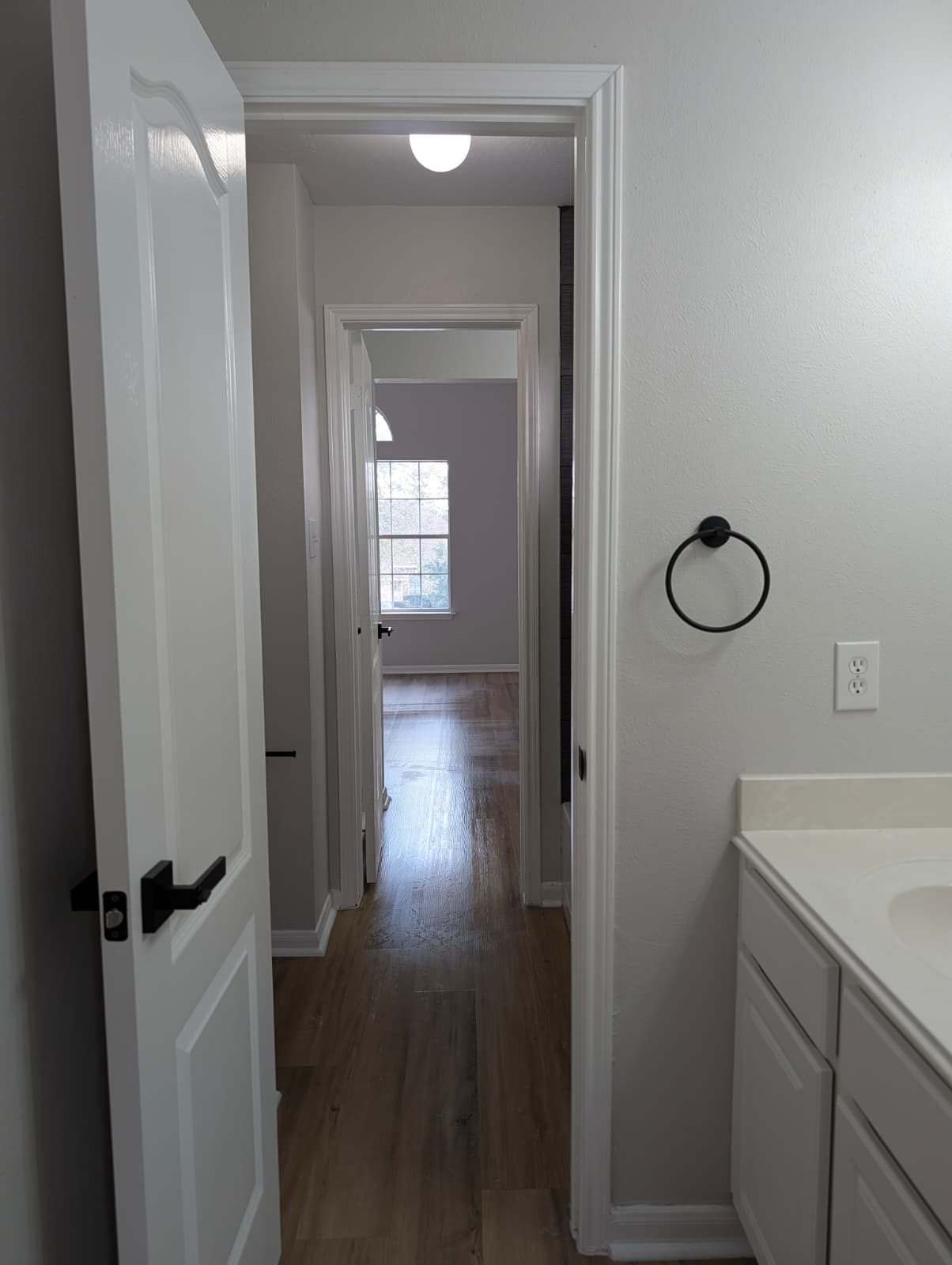 Bathroom doorway and hallway after the remodel