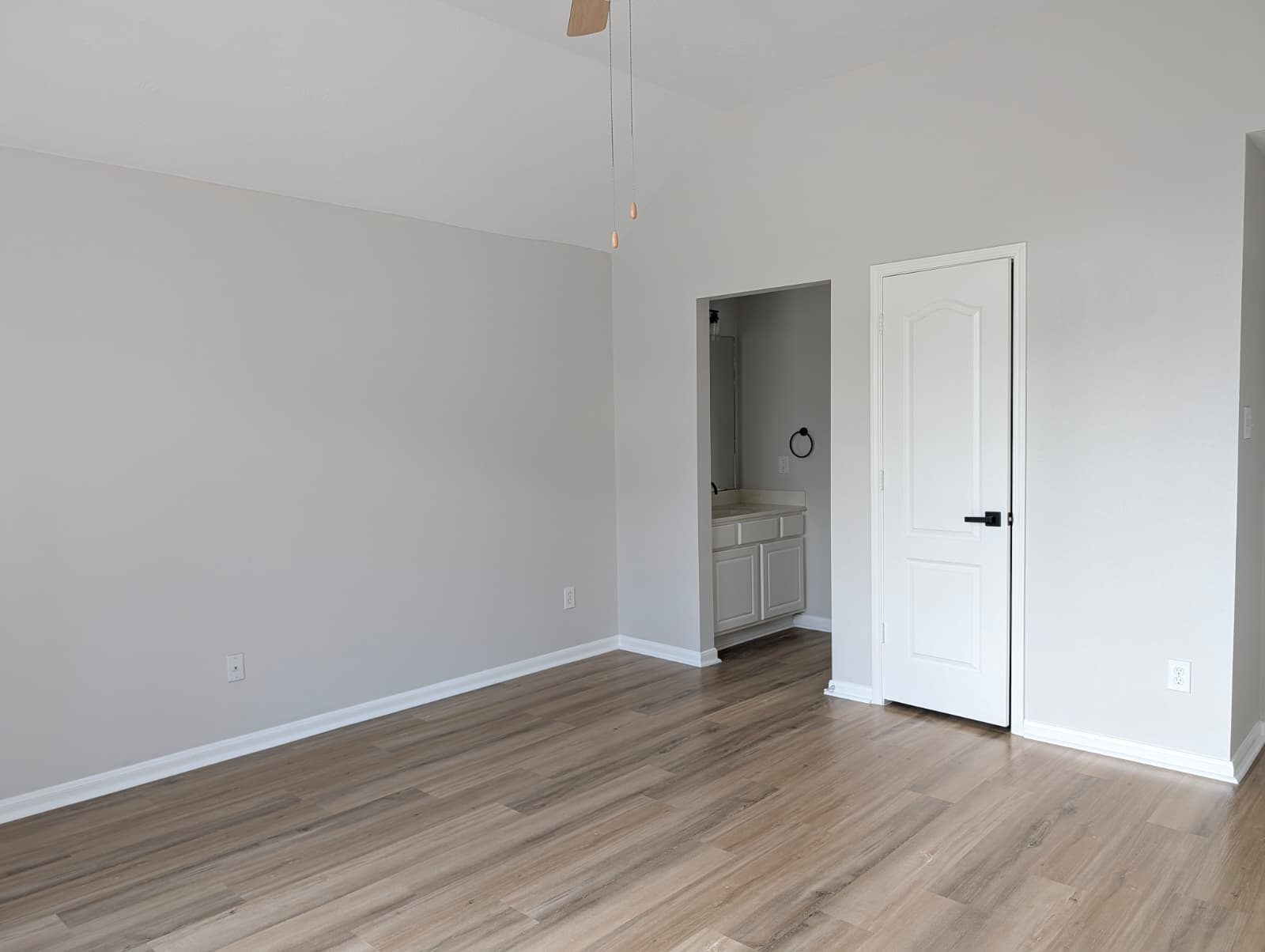 Bedroom with a door to the updated bathroom