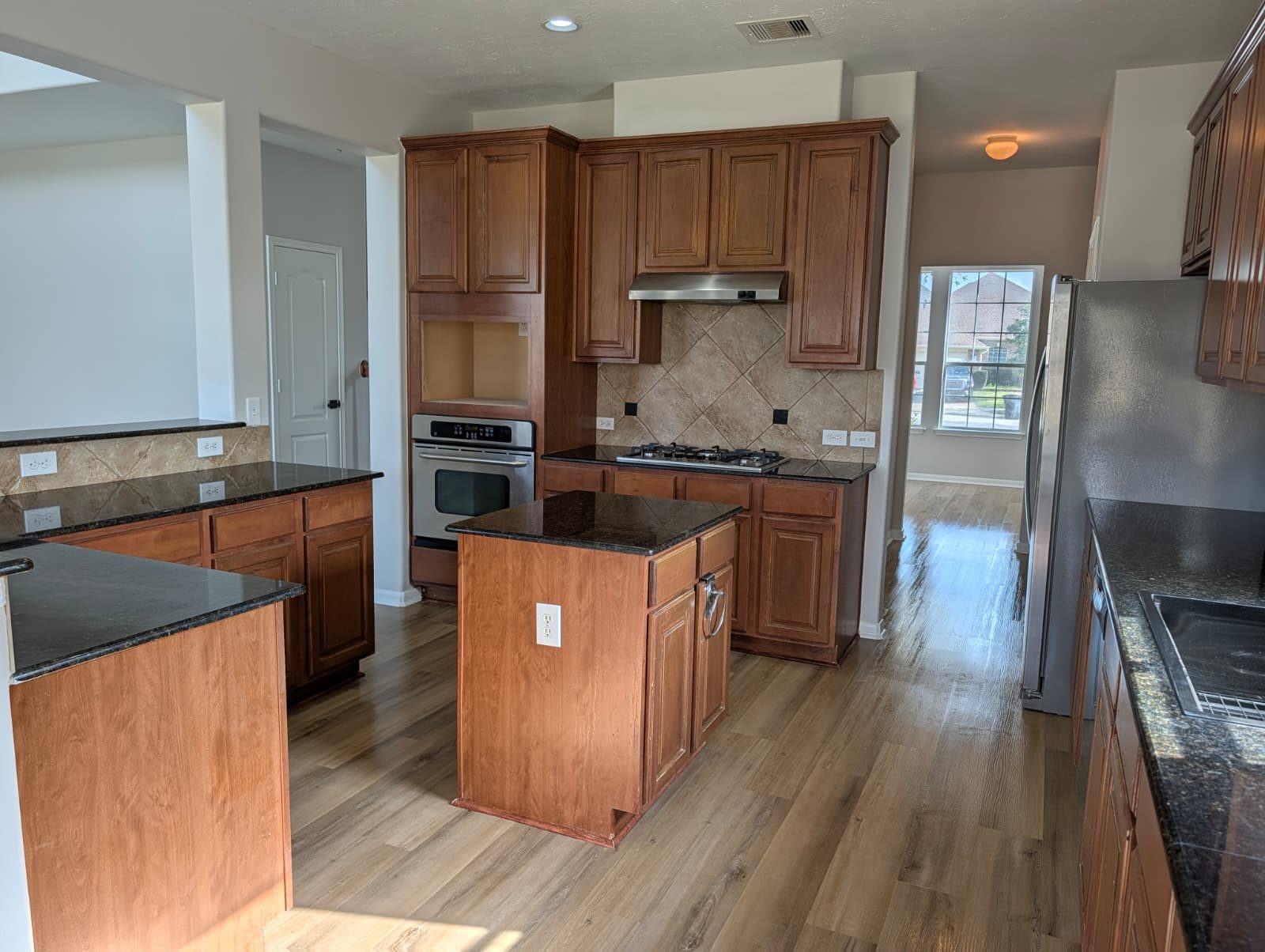 Wide view of the remodeled kitchen with new flooring