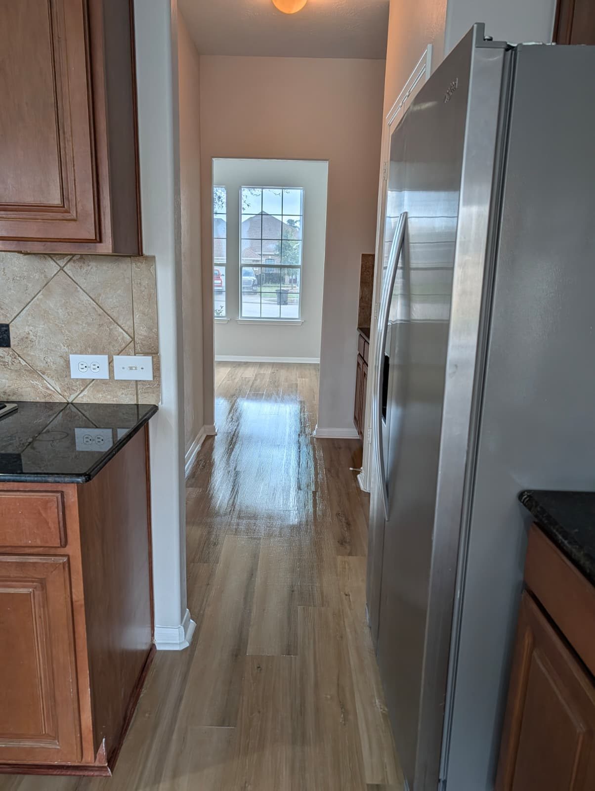 Hall beside the kitchen after new wood-look flooring