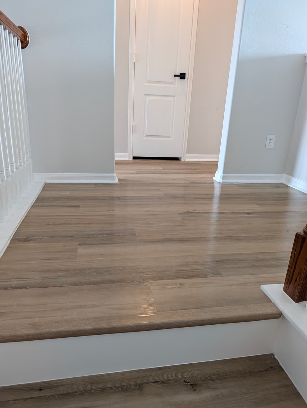 Upstairs landing with new flooring after the remodel