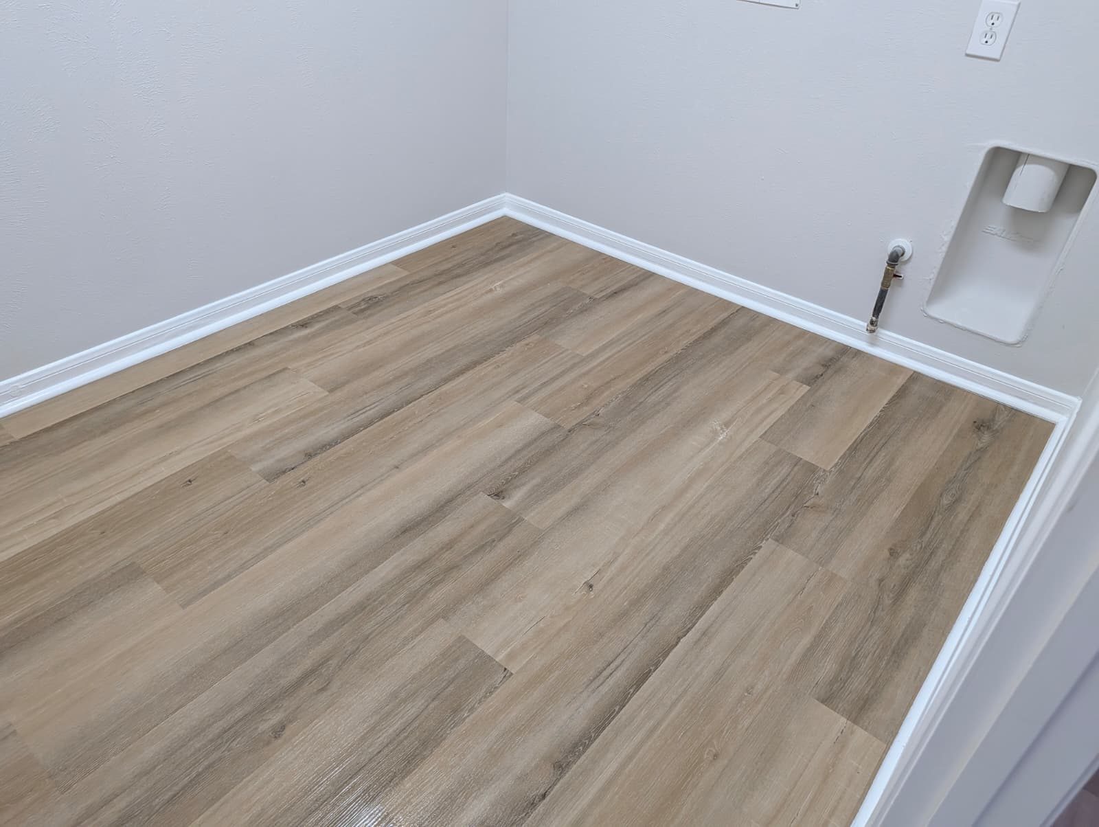 Laundry room floor after new wood-look flooring
