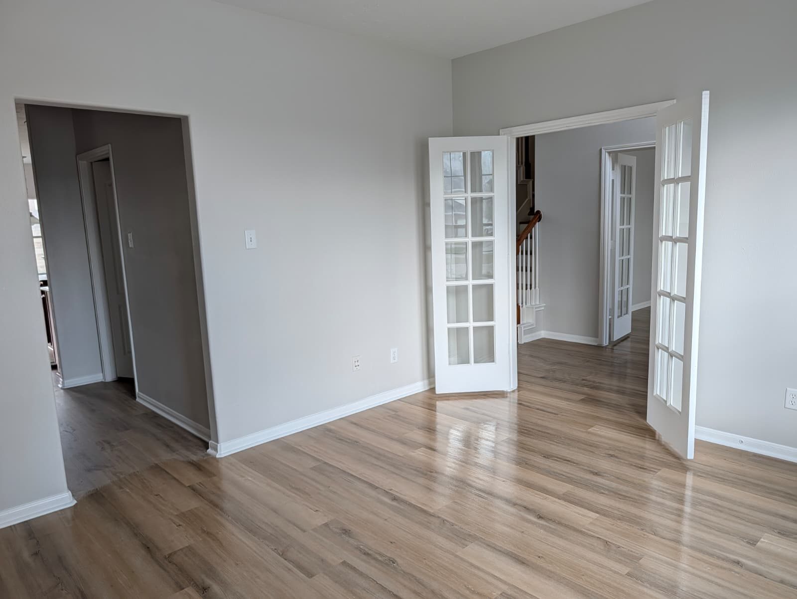 Main level after remodel with French doors and new floors