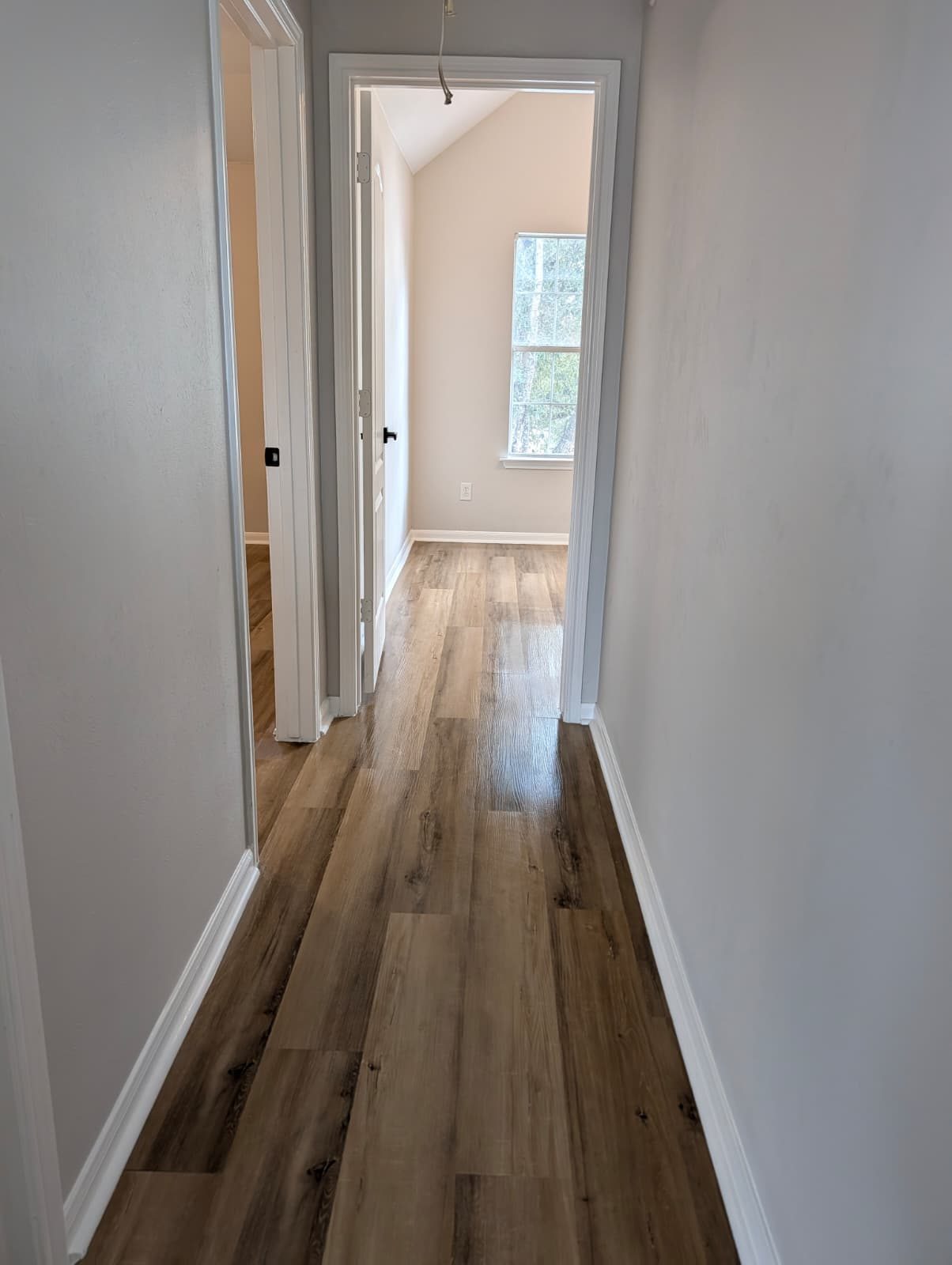 Upstairs hallway with new wood-look floors