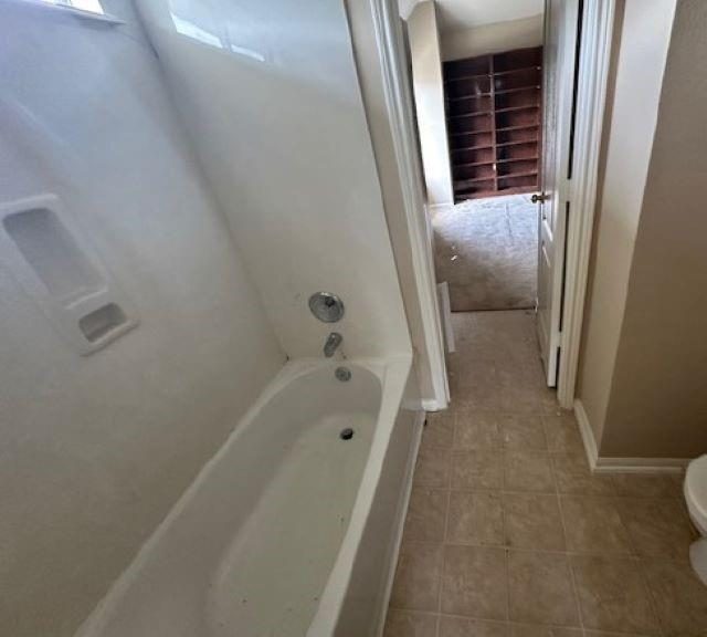 Original white bathtub before the bathroom remodel