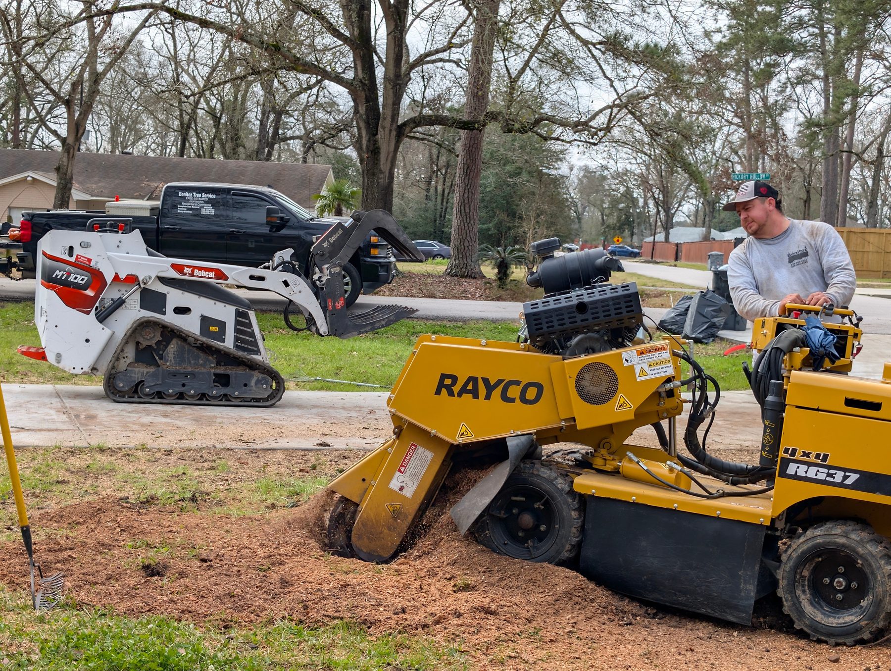 Stump being ground below grade after tree removal